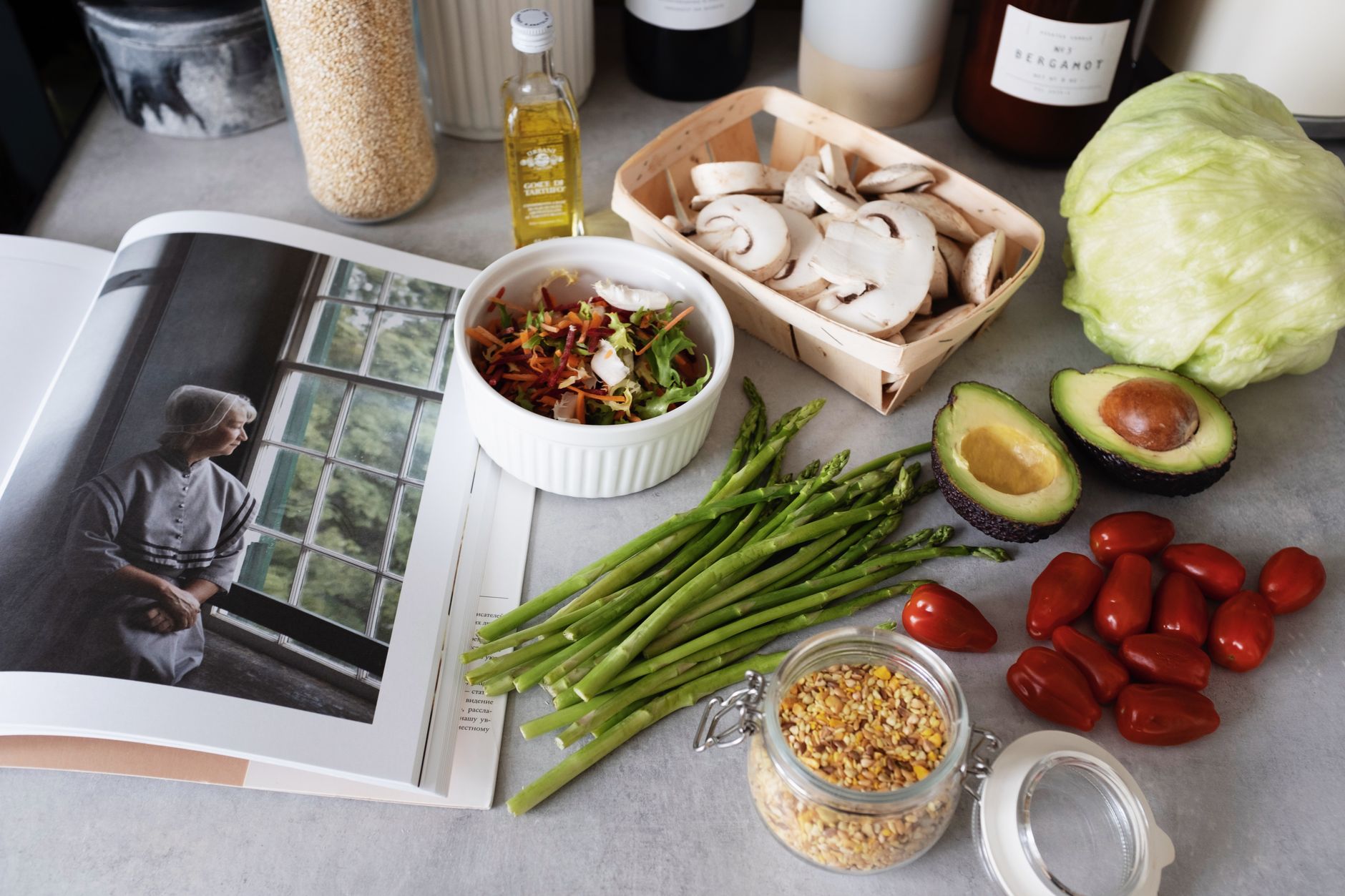 A selection of fresh vegetables and a cookbook in a kitchen setting, promoting healthy cooking. — American BBQ Restaurant in